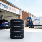 195/65 R15 tyres with visible tread pattern and car in background in Kettering setting