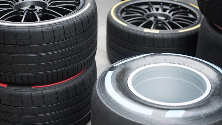 Mechanic fitting cheap tyres in Kettering with customer booking tyres online.