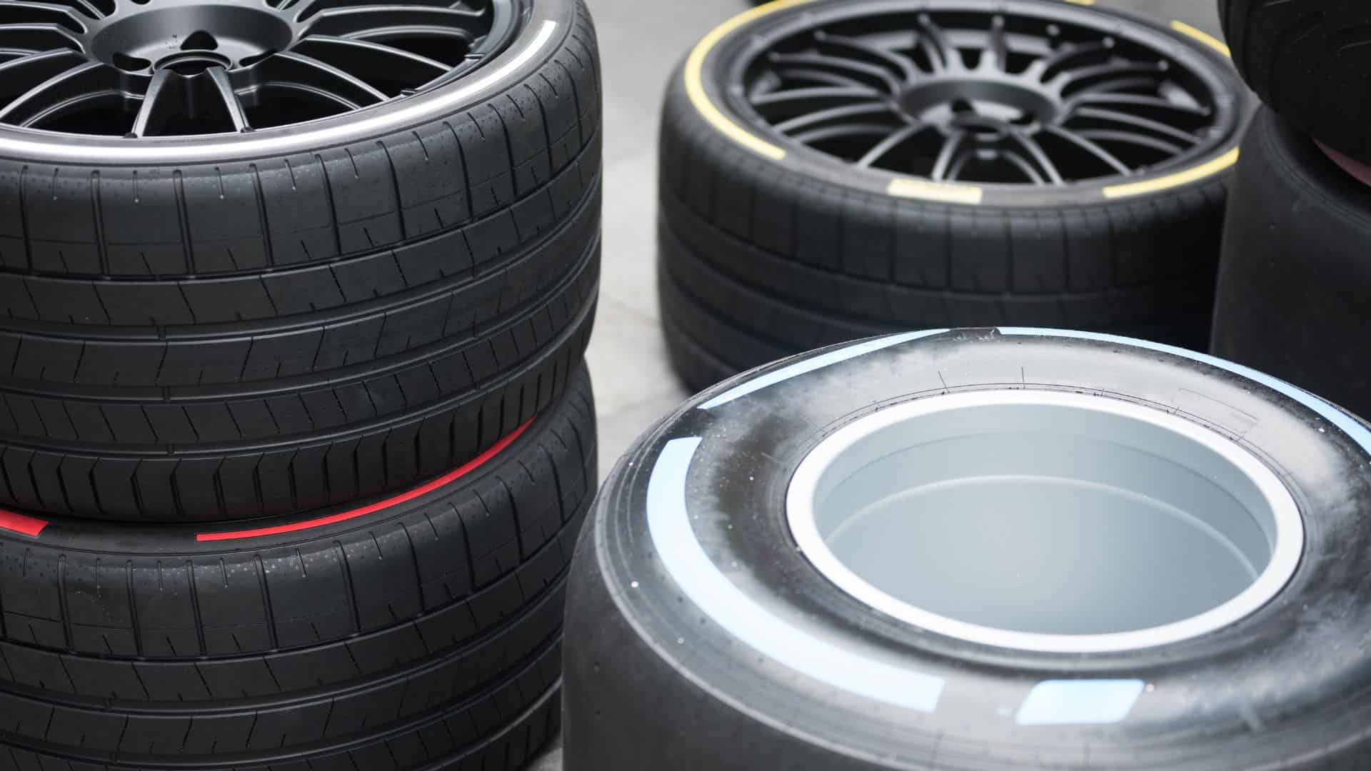 Mechanic fitting cheap tyres in Kettering with customer booking tyres online.